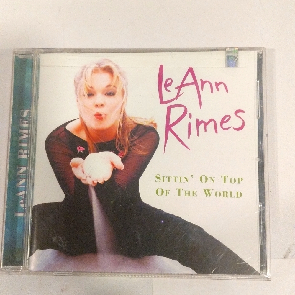 New LeAnn Rimes sitting on top of the world sealed new